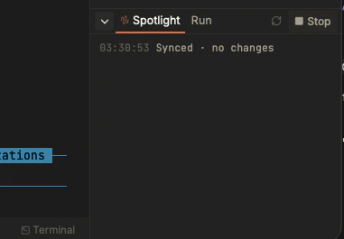 Close-up of the Spotlight panel showing a timestamped Synced status with no changes, alongside Run and Stop buttons.